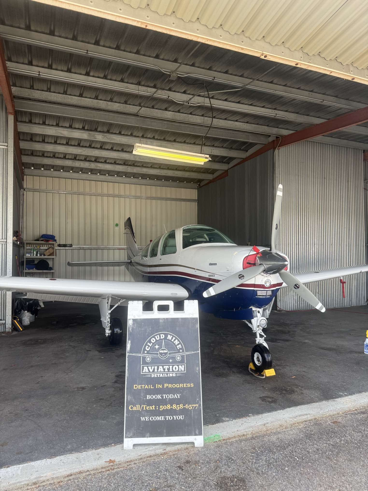 Aircraft being detailed in a hangar at Norwood Airport